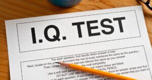 - Treat Mental Health California IQ test answer sheet on a wooden desk with a yellow pencil resting on it