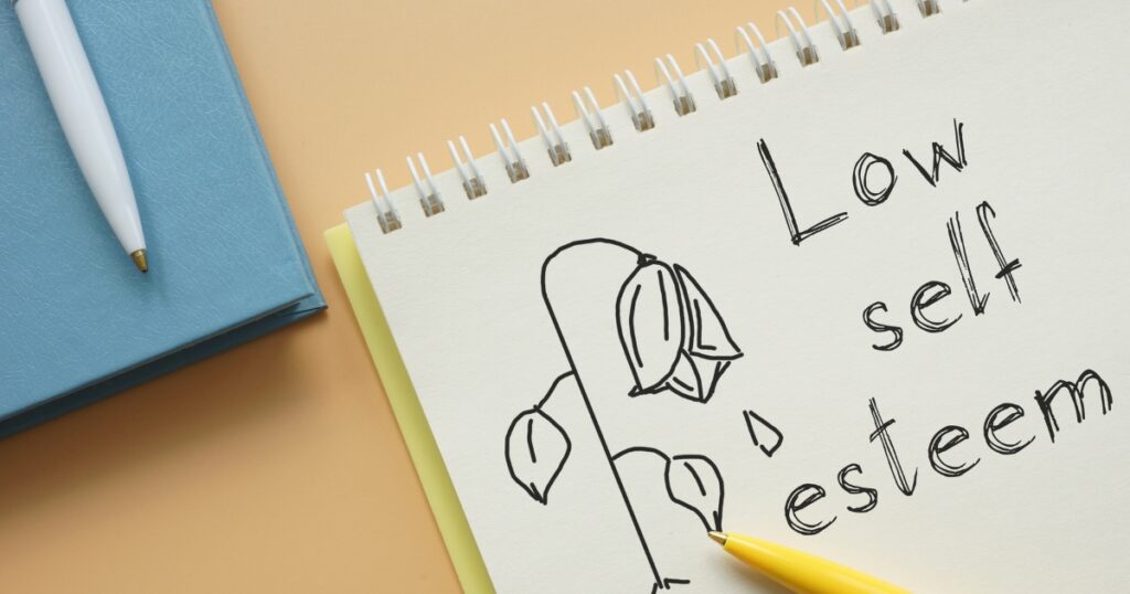 what causes low self esteem — featured image